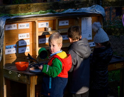 Children playing sensory games outside 