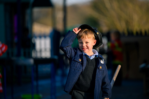 boy playing dress up
