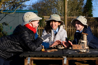 children making animal homes in Forest School