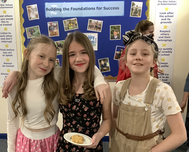 Girls dressed up in World War 2 attire for the Tea dance